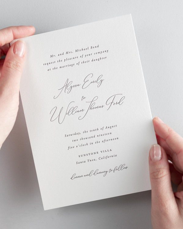 Bride holding her 5x7” Alyssa letterpress wedding invitation.
