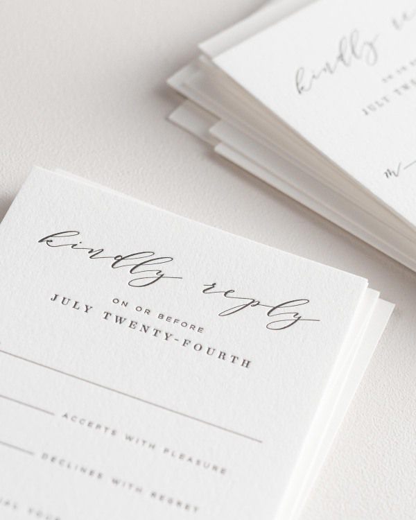 Dreamy close up shot of Amelia response cards. Deep impressions in the paper are a result of the letterpress printing process.