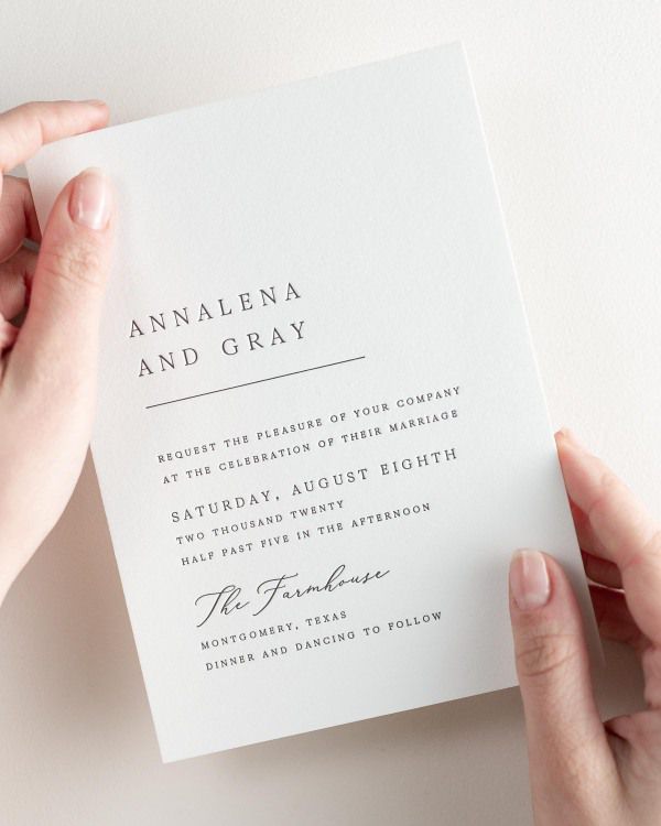 Bride holding her 5x7” Annalena letterpress wedding invitation.