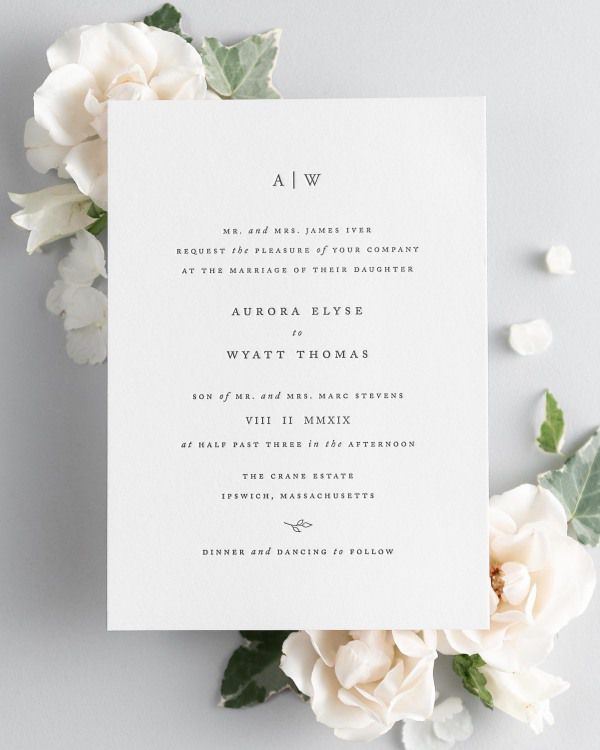 Aurora letterpress wedding invitation styled with pretty florals.