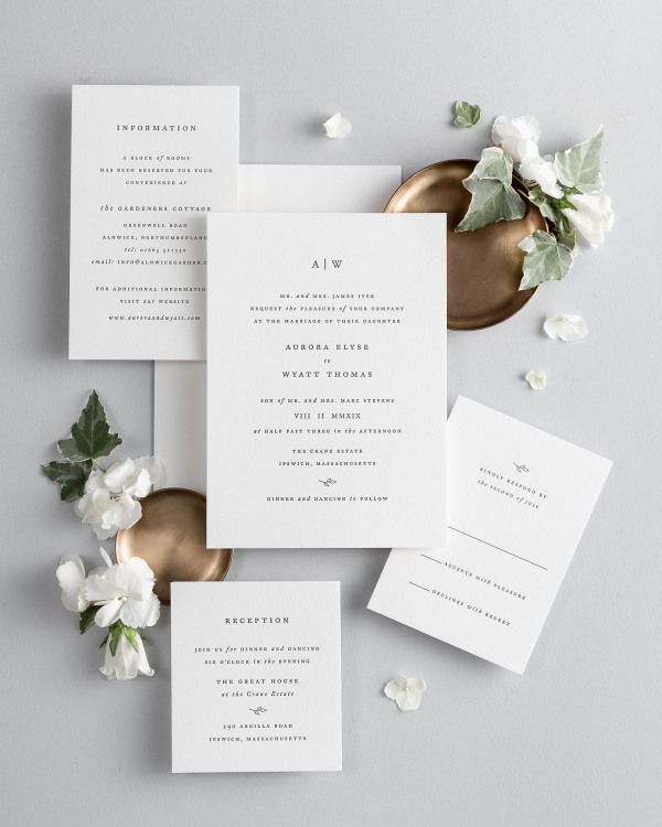 All pieces of the Aurora letterpress wedding invitation suite, including the invitation, small and large enclosures, and response card.