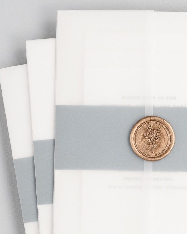 Wedding invitations with vellum jacket and wax seal