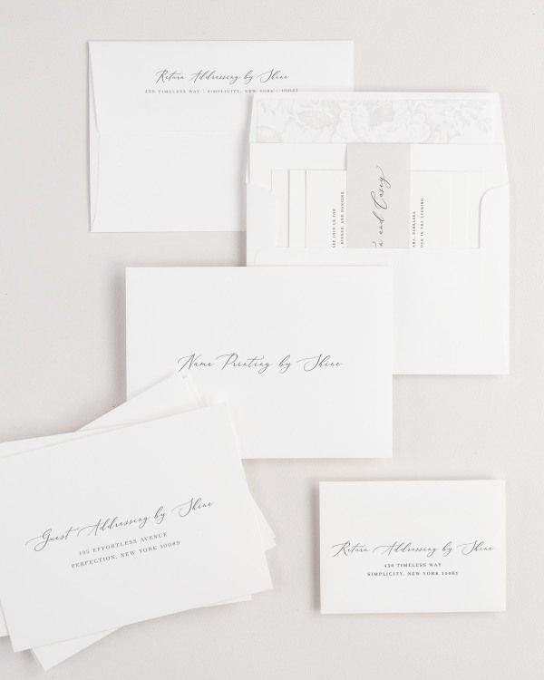 Austin wedding invitation envelopes with guest addressing, return addressing, and name printing services. Inner envelope features a garden rose liner and soft gray belly band.