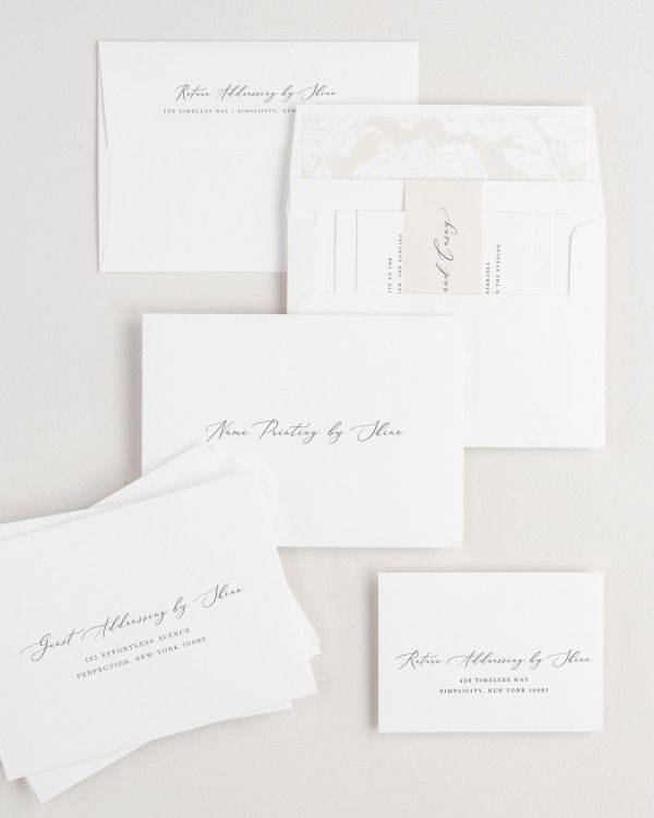 Austin wedding invitation envelopes with guest addressing, return addressing, and name printing services. Inner envelope features a blooms liner and nude belly band.
