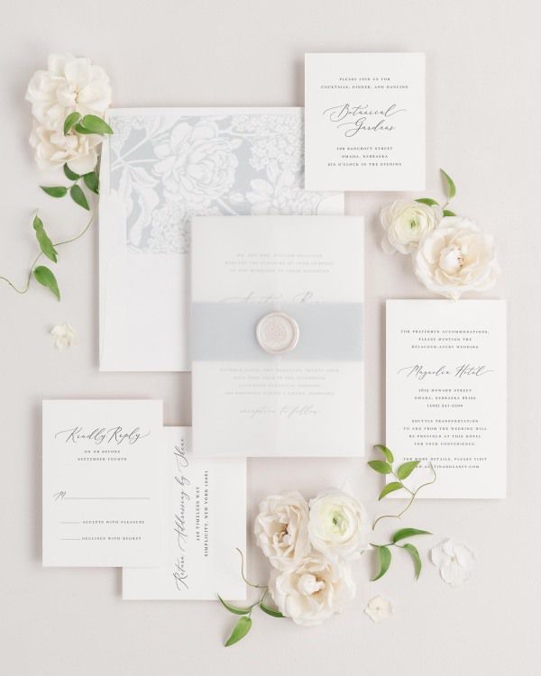 Austin wedding invitations flat lay with cloud hydrangea liner, cloud belly band, and pearl florette wax seal.