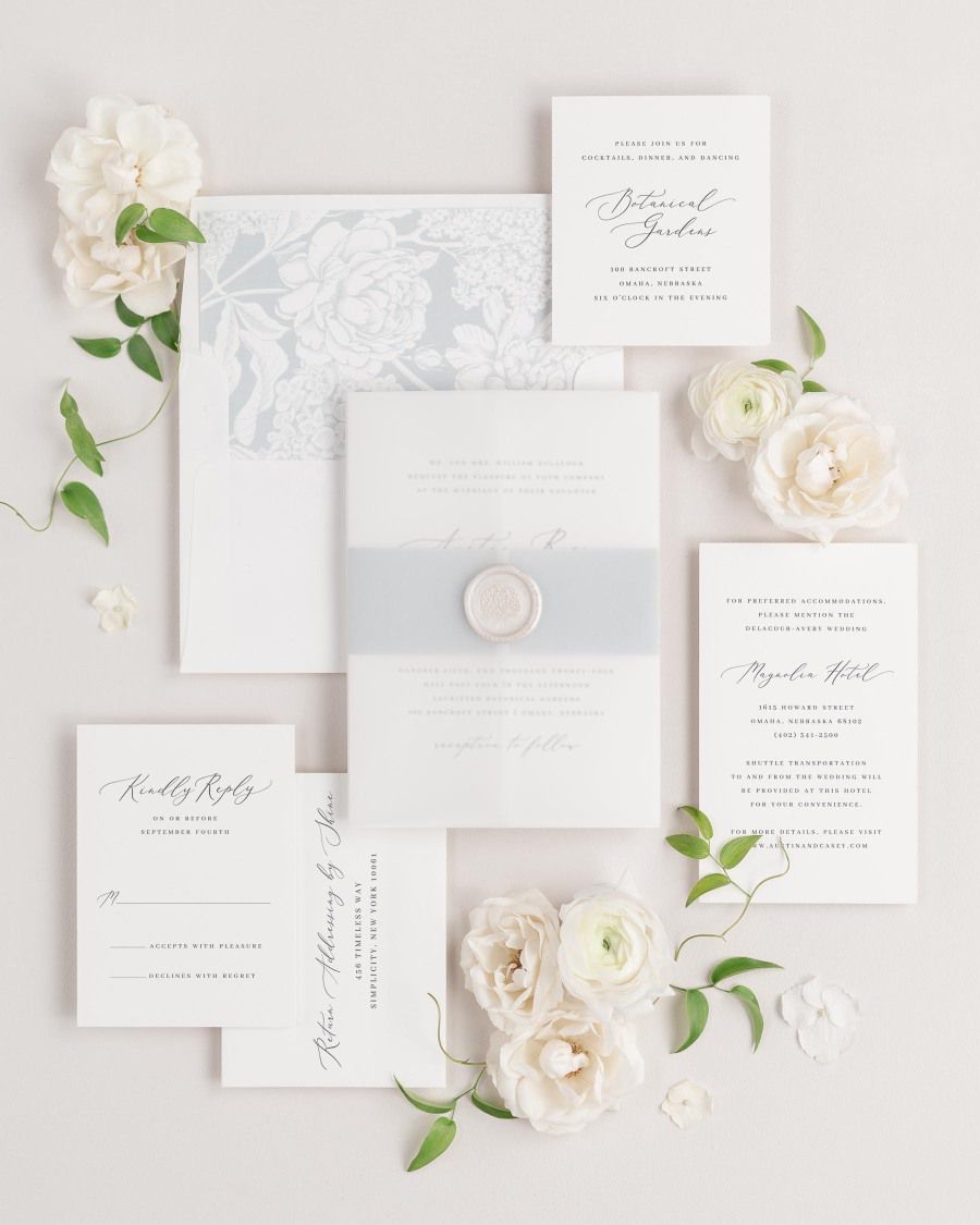 Austin wedding invitations flat lay with cloud hydrangea liner, cloud belly band, and pearl florette wax seal.