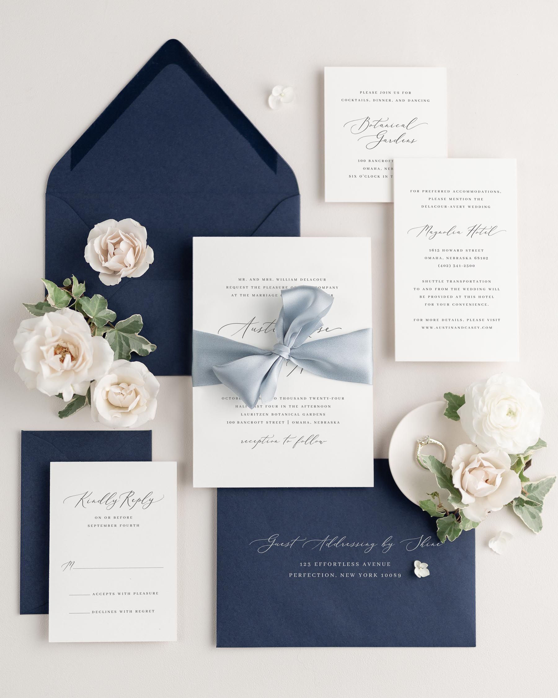 Wedding invitations with silk ribbon in blue envelope