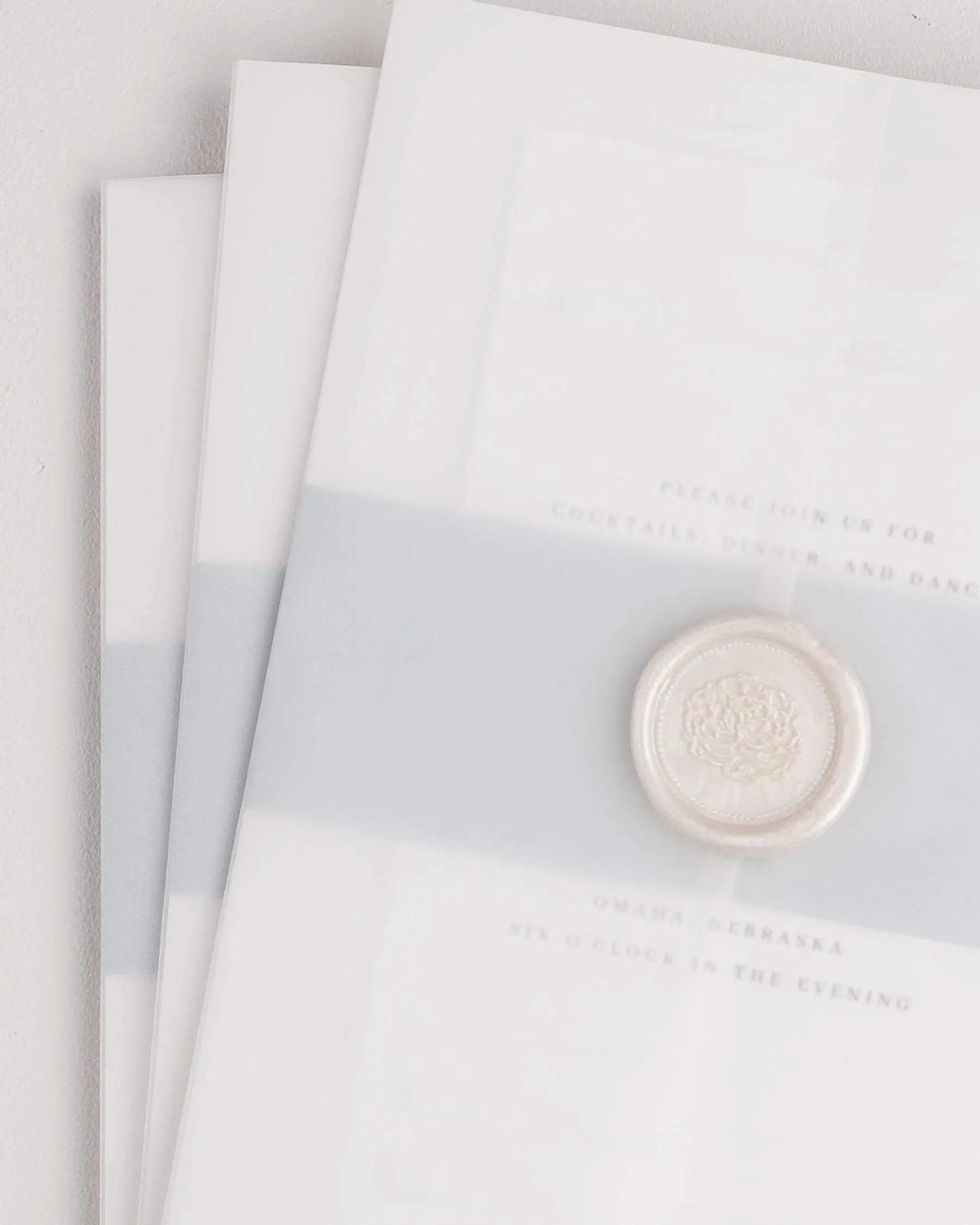 Assembled Austin Wedding Invitation Suites with Cloud Belly Bands, Vellum Jackets, and Pearl Wreath Wax Seals