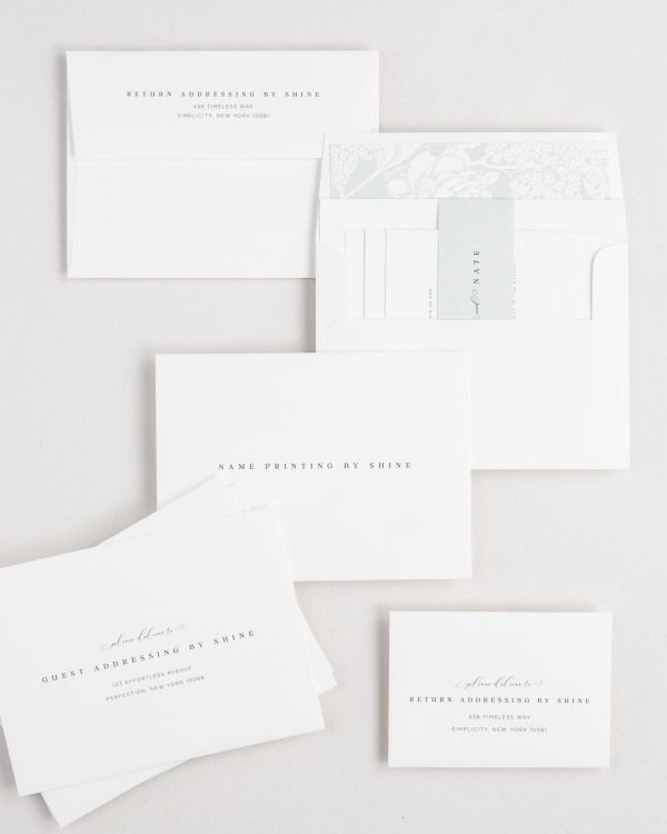 Bethany wedding invitation envelopes with guest addressing, return addressing, and name printing services. Inner envelope features a hydrangea liner and sea salt belly band.