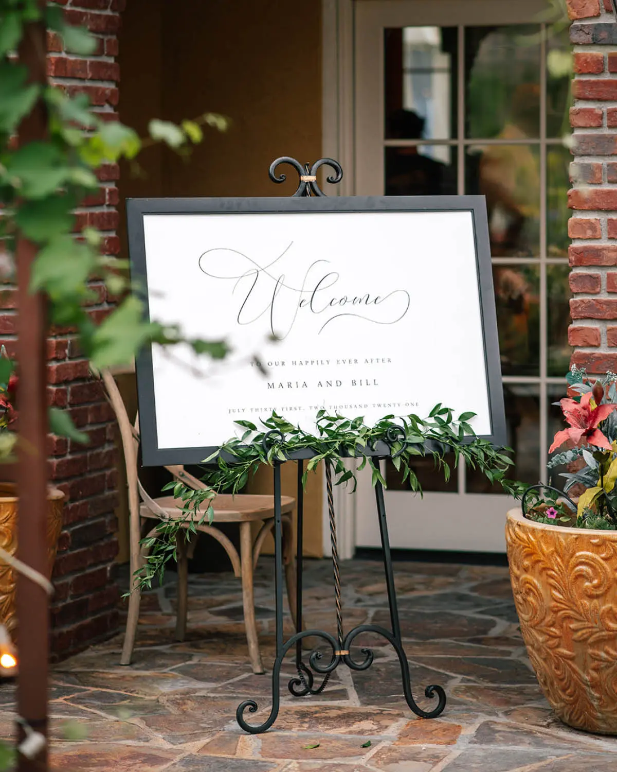 Ophelia Welcome Sign in a Black Frame on an Iron Easel, Styled with Florals