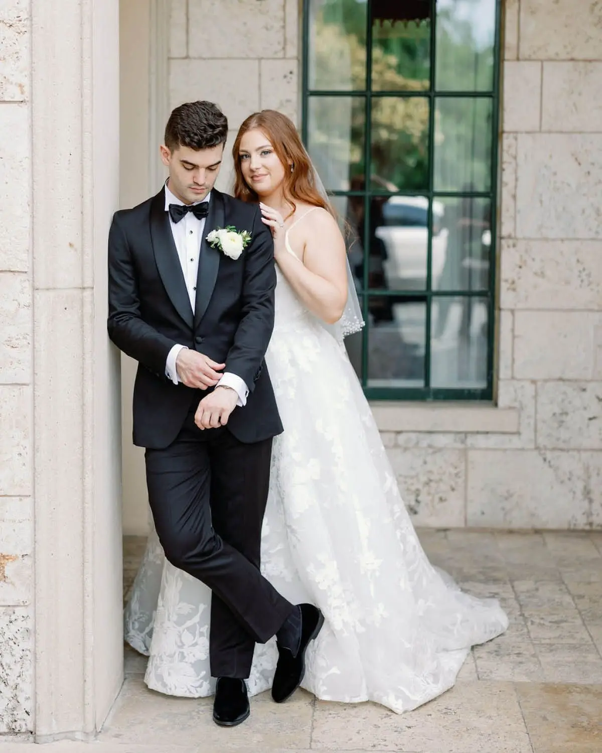 The Bride and Groom Leaning on a Wall