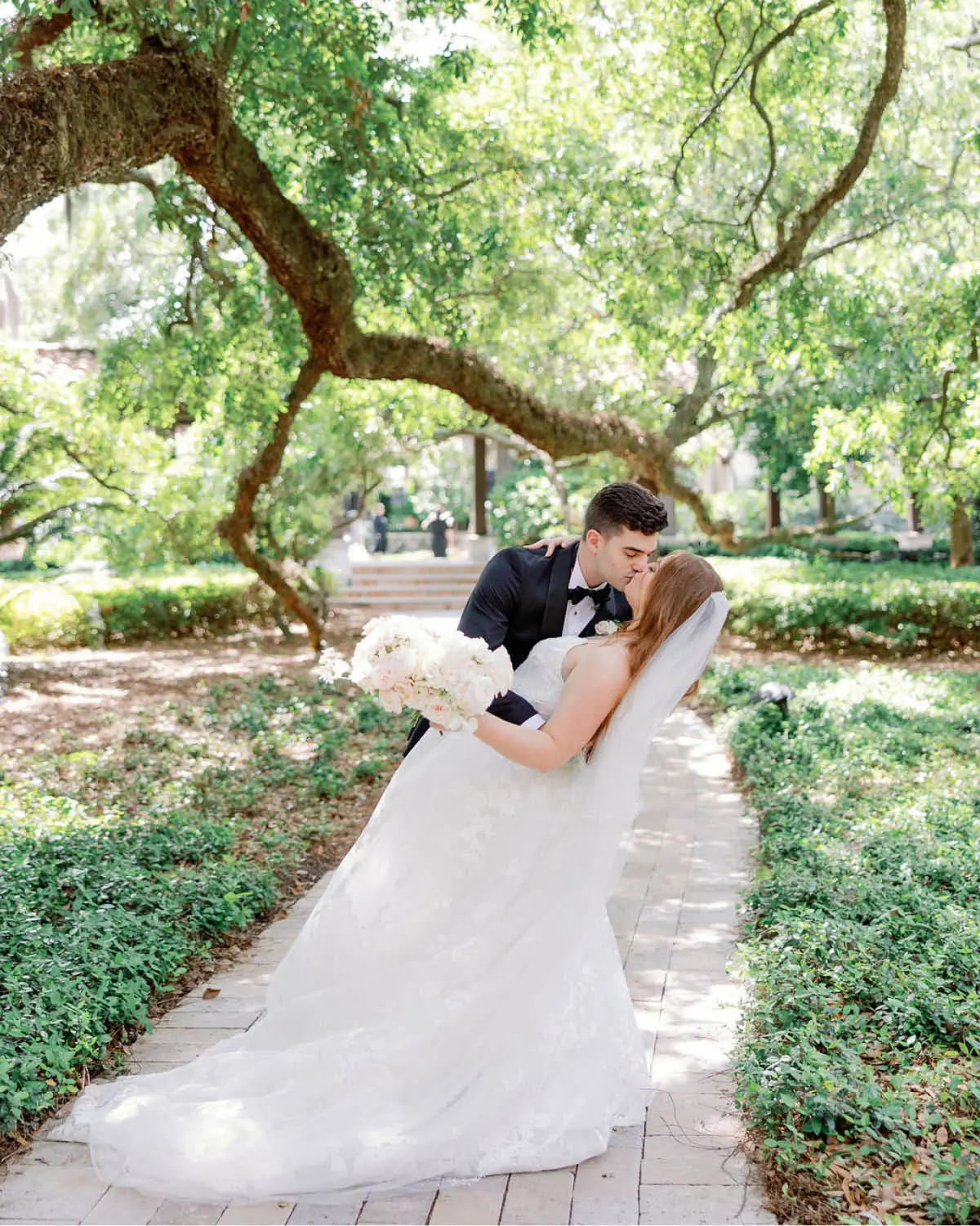 The Groom Dips the Bride and Shares a Kiss