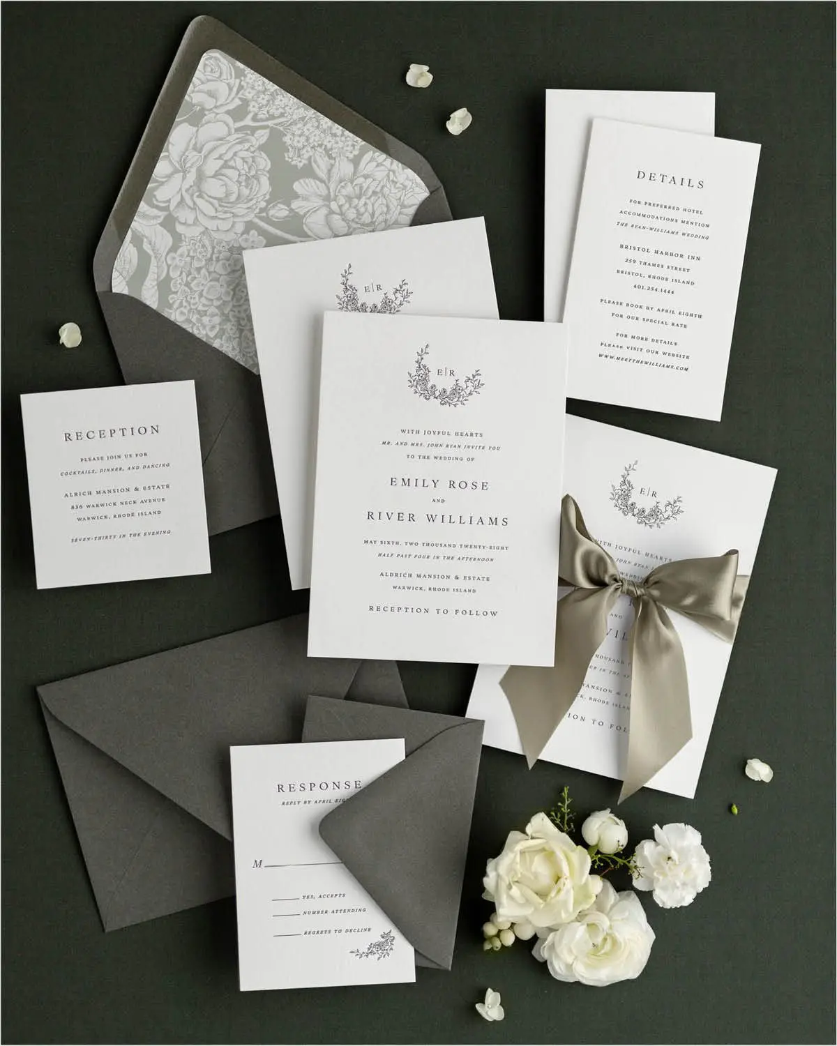 Emily Letterpress Wedding Invitations styled with dark gray envelopes and moss green silk ribbon