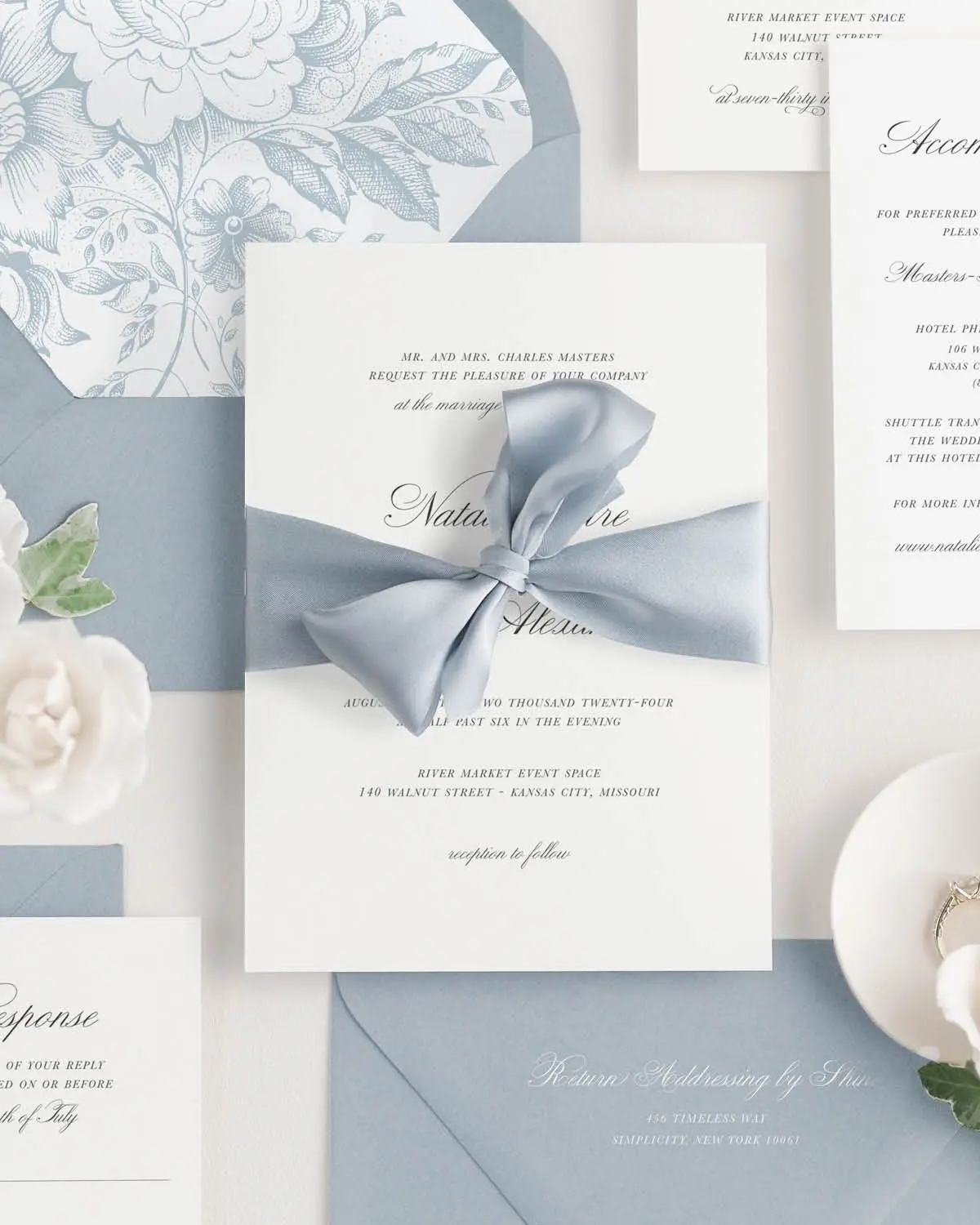 Light Blue Gray Ribbon Tied Around a Classic Script Wedding Invitation
