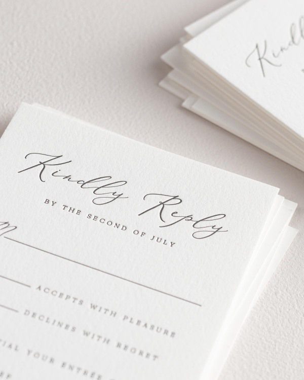 Dreamy close up shot of Cecilia response cards. Deep impressions in the paper are a result of the letterpress printing process.