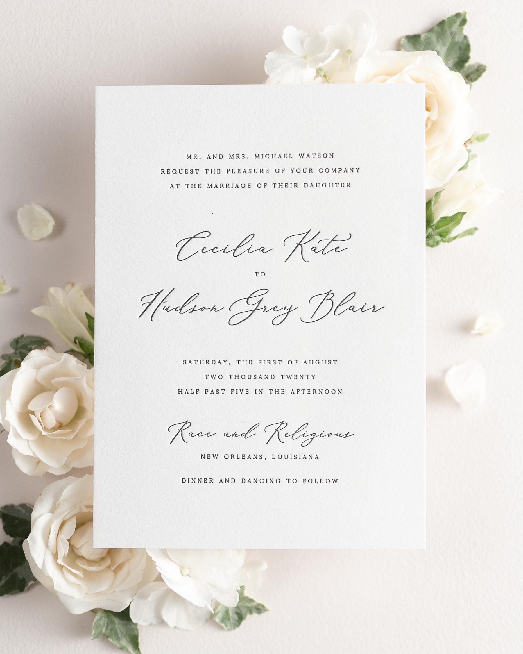 Cecilia letterpress wedding invitation styled with pretty florals.