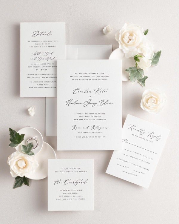 All pieces of the Cecilia letterpress wedding invitation suite, including the invitation, small and large enclosures, and response card.