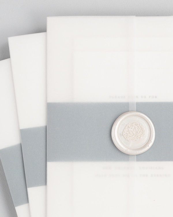 Wedding invitations with vellum jacket and wax seal