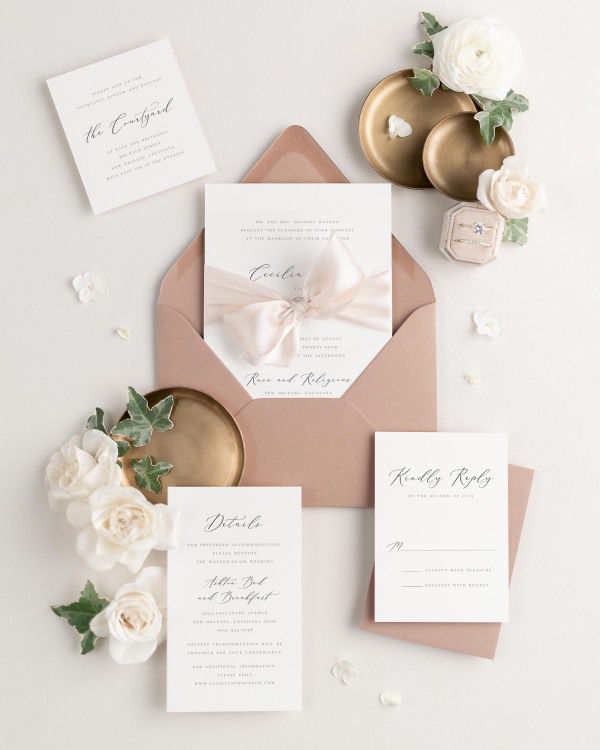Wedding invitations with silk ribbon in light terracotta envelope