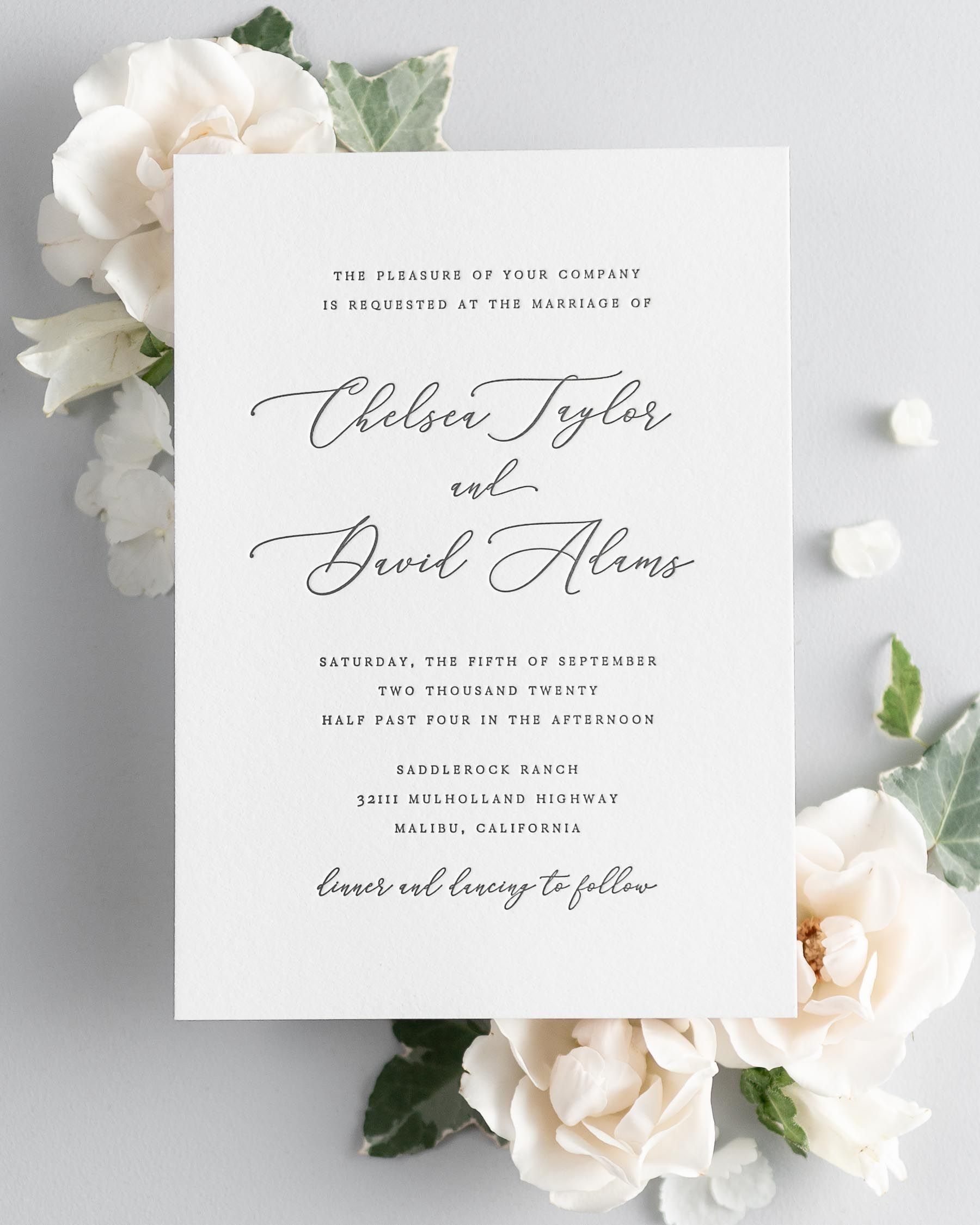 Chelsea letterpress wedding invitation styled with pretty florals.