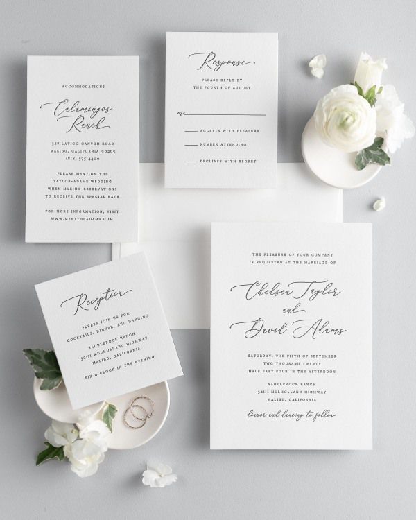 All pieces of the Chelsea letterpress wedding invitation suite, including the invitation, small and large enclosures, and response card.