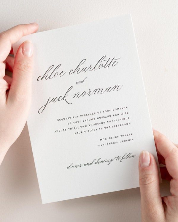 Bride holding her 5x7” Chloe letterpress wedding invitation.