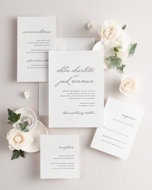 All pieces of the Chloe letterpress wedding invitation suite, including the invitation, small and large enclosures, and response card.
