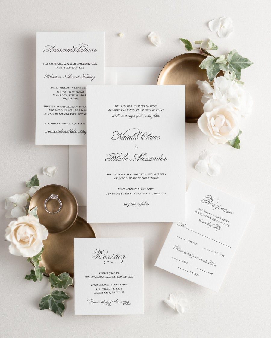All pieces of the Classic Script letterpress wedding invitation suite, including the invitation, small and large enclosures, and response card.