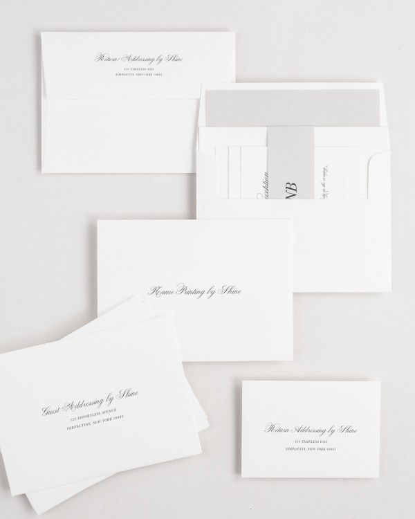 Classic Script wedding invitation envelopes with guest addressing, return addressing, and name printing services. Inner envelope features a solid liner and stone belly band.