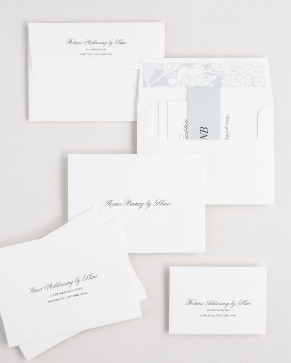Classic Script wedding invitation envelopes with guest addressing, return addressing, and name printing services. Inner envelope features a hydrangea liner and cloud belly band.