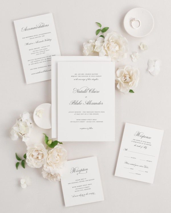 Classic Script wedding invitations flat lay with
