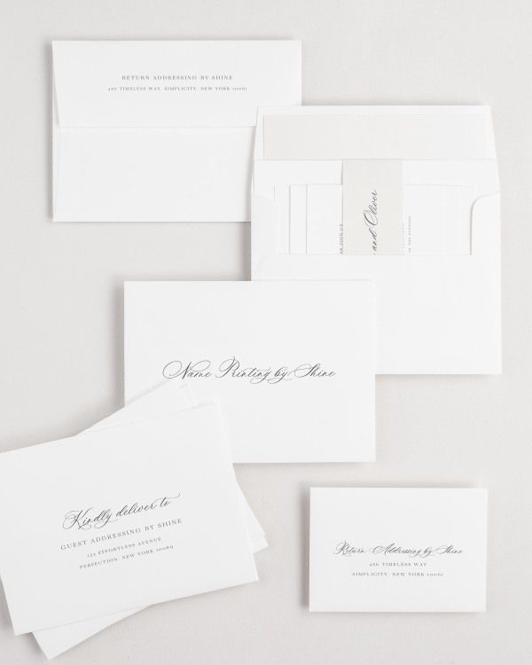 Claudia wedding invitation envelopes with guest addressing, return addressing, and name printing services. Inner envelope features a simple watercolor liner and nude belly band.