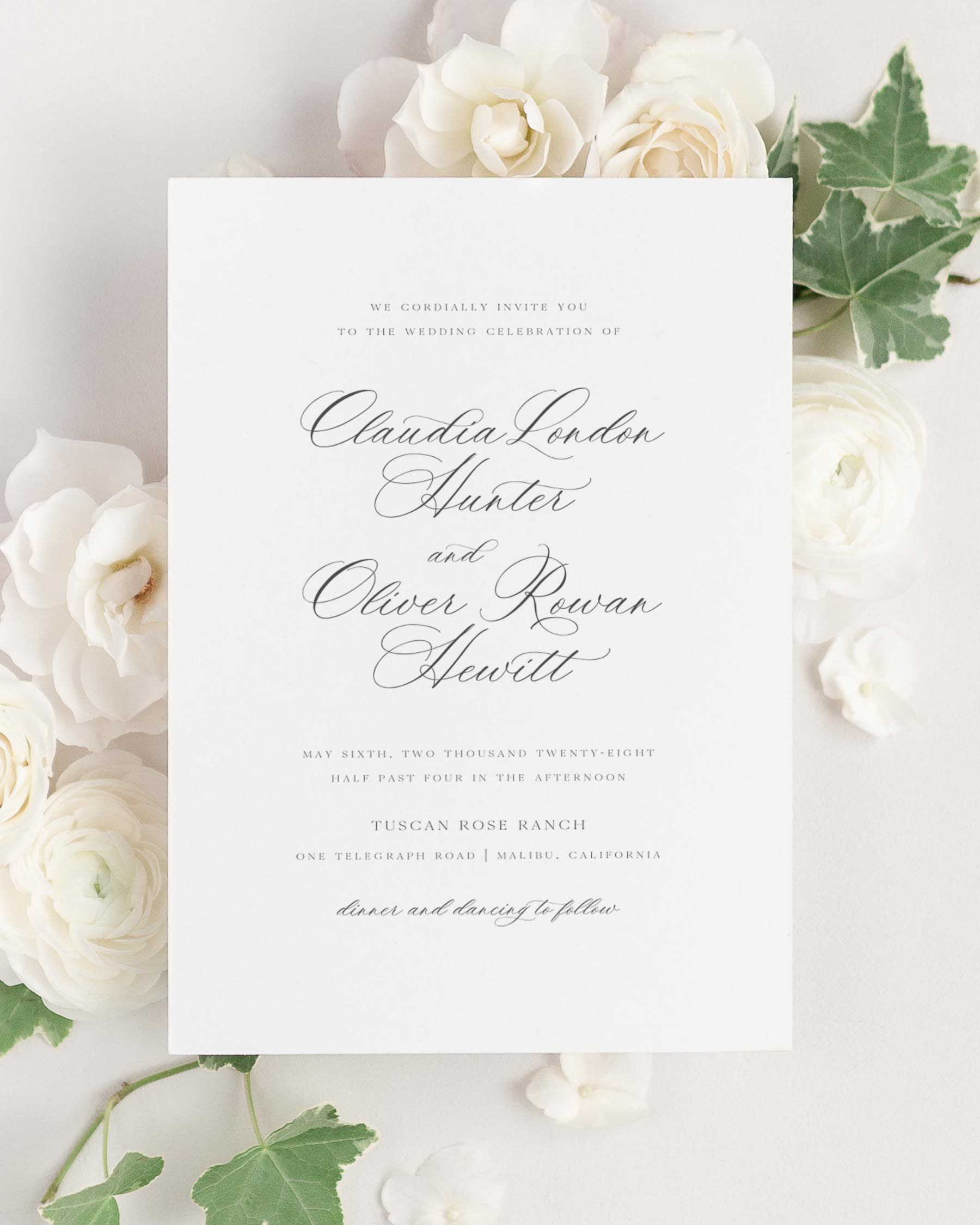 Claudia wedding invitation framed with dreamy florals.