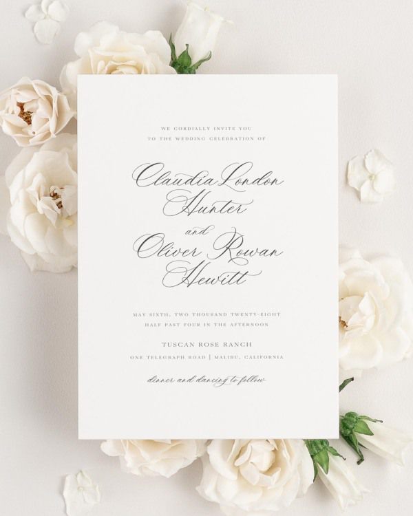 Claudia wedding invitation framed with dreamy florals.