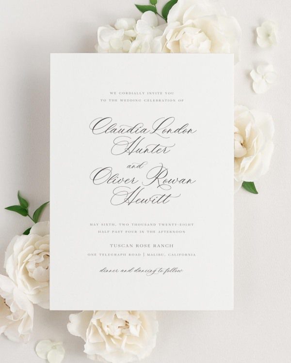Claudia wedding invitation framed with dreamy florals.