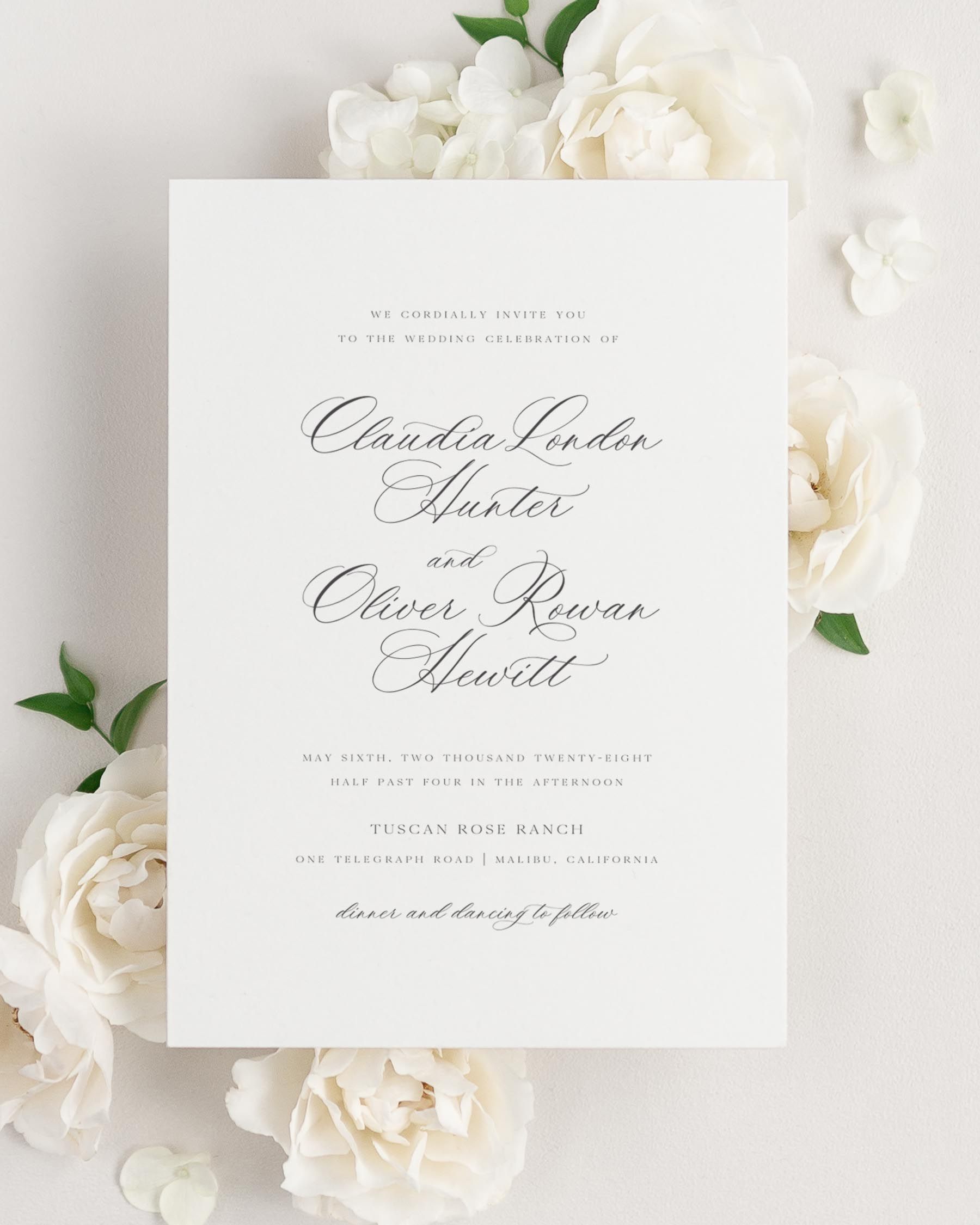 Claudia wedding invitation framed with dreamy florals.