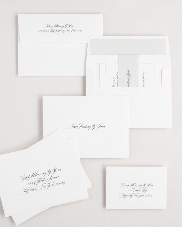 Danielle wedding invitation envelopes with guest addressing, return addressing, and name printing services. Inner envelope features a solid liner and soft gray belly band.