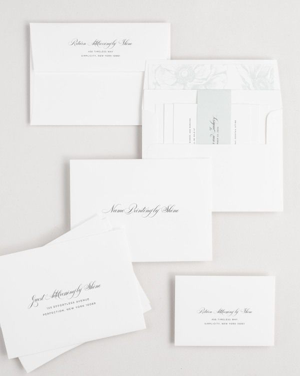 Delicate Elegance wedding invitation envelopes with guest addressing, return addressing, and name printing services. Inner envelope features a anemones liner and sea salt belly band.