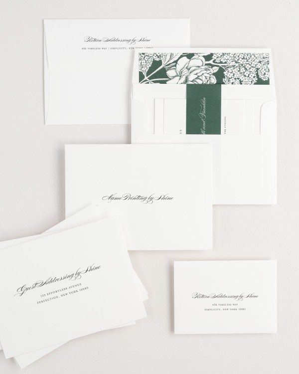 Elizabeth wedding invitation envelopes with guest addressing, return addressing, and name printing services. Inner envelope features a hydrangea liner and ivy belly band.