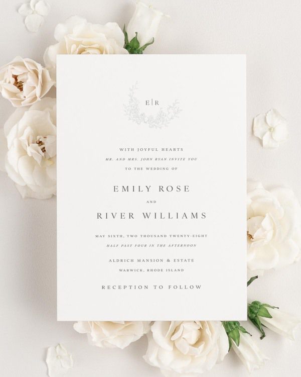 Emily wedding invitation framed with dreamy florals.