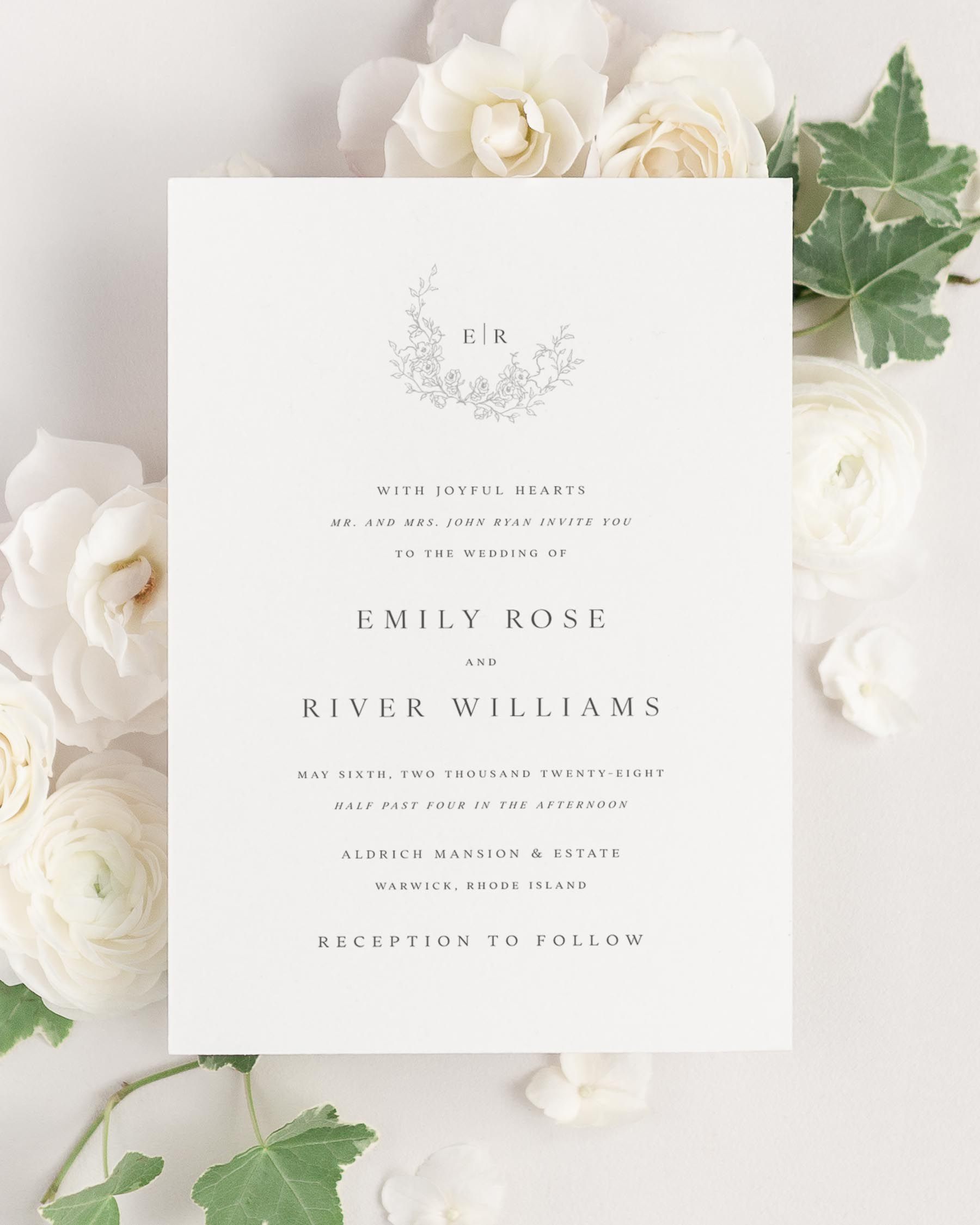 Emily wedding invitation framed with dreamy florals.