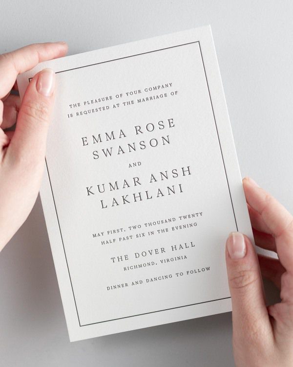 Bride holding her 5x7” Emma letterpress wedding invitation.