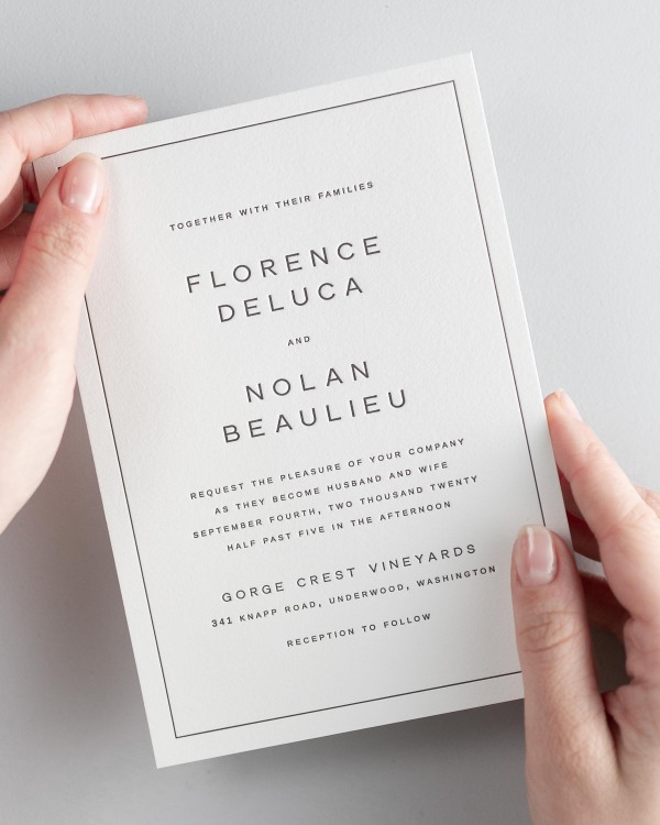 Bride holding her 5x7” Florence letterpress wedding invitation.