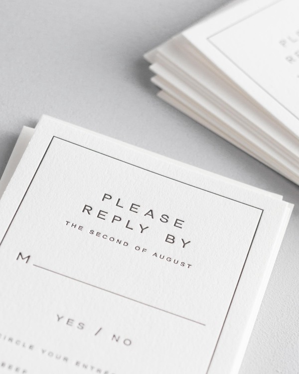 Dreamy close up shot of Florence response cards. Deep impressions in the paper are a result of the letterpress printing process.