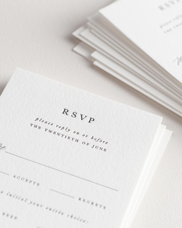 Dreamy close up shot of Gabriella response cards. Deep impressions in the paper are a result of the letterpress printing process.