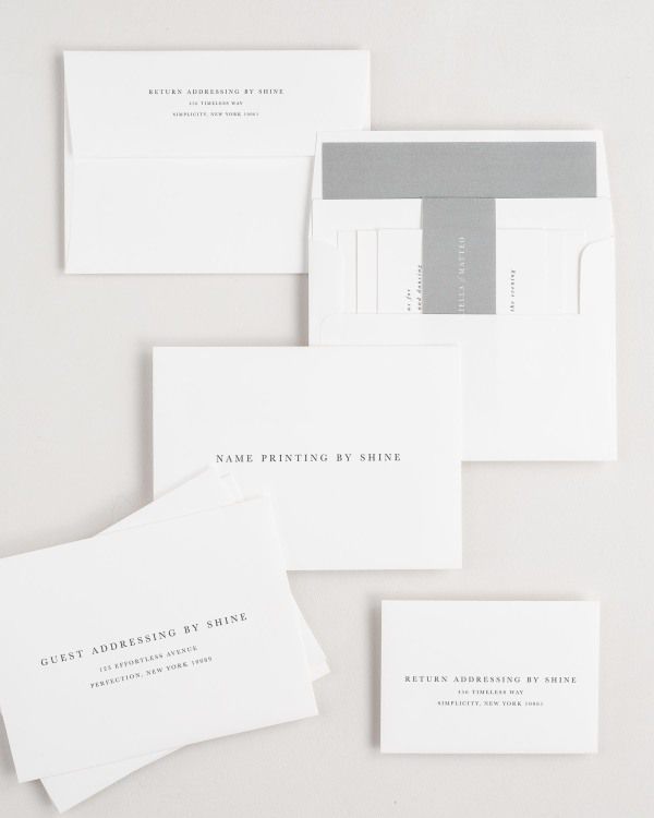 Gabriella wedding invitation envelopes with guest addressing, return addressing, and name printing services. Inner envelope features a solid liner and slate belly band.