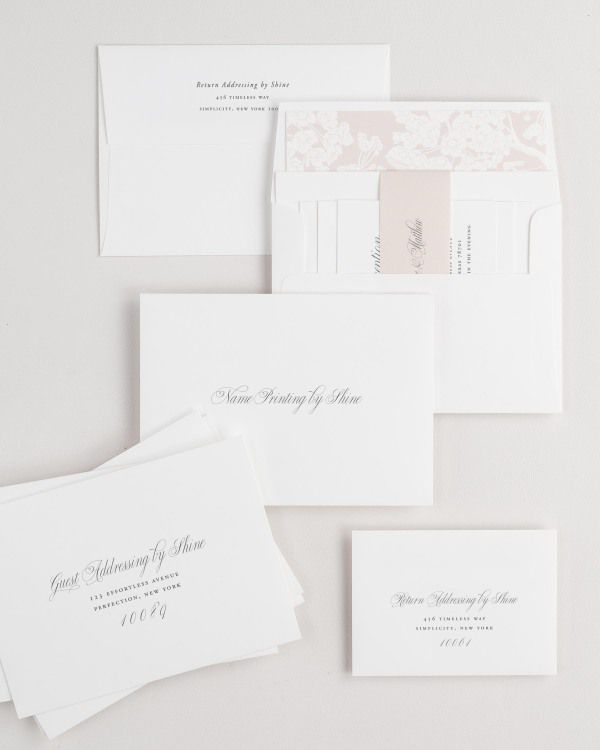 Garden Elegance wedding invitation envelopes with guest addressing, return addressing, and name printing services. Inner envelope features a petite fleur liner and rose gold belly band.