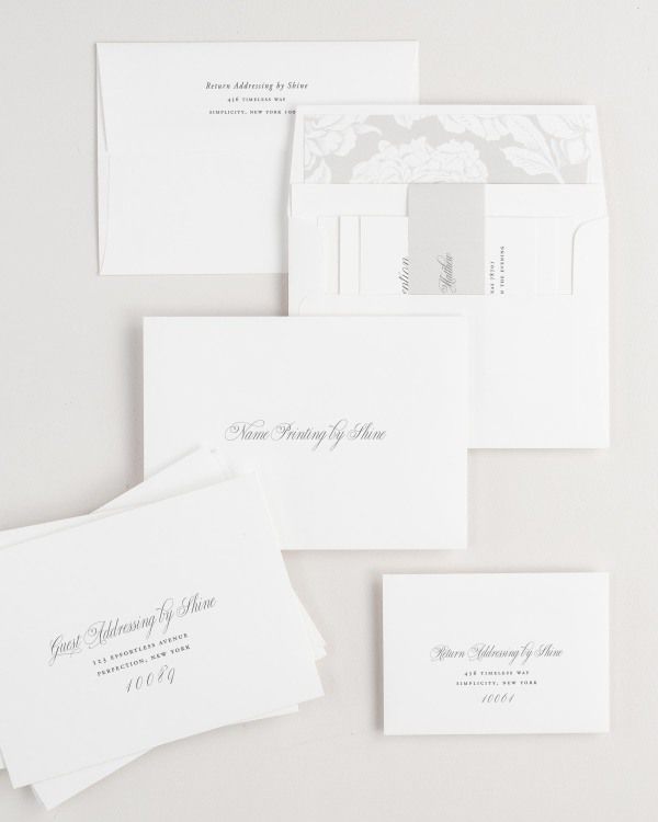 Garden Elegance wedding invitation envelopes with guest addressing, return addressing, and name printing services. Inner envelope features a blooms liner and stone belly band.