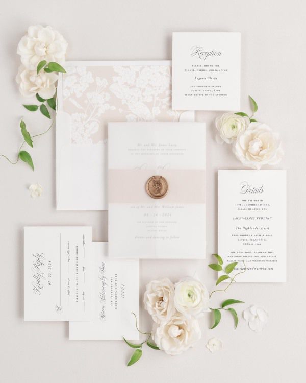 Garden Elegance wedding invitations flat lay with rose gold petite fleur liner, rose gold belly band, translucent vellum jacket, and gold posy wax seal.