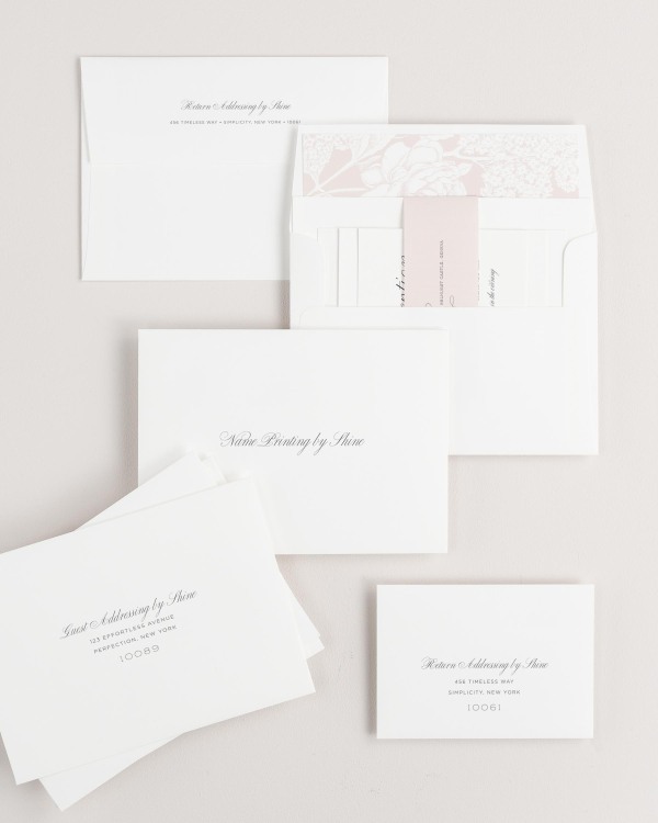Garden Script wedding invitation envelopes with guest addressing, return addressing, and name printing services. Inner envelope features a hydrangea liner and vintage blush belly band.